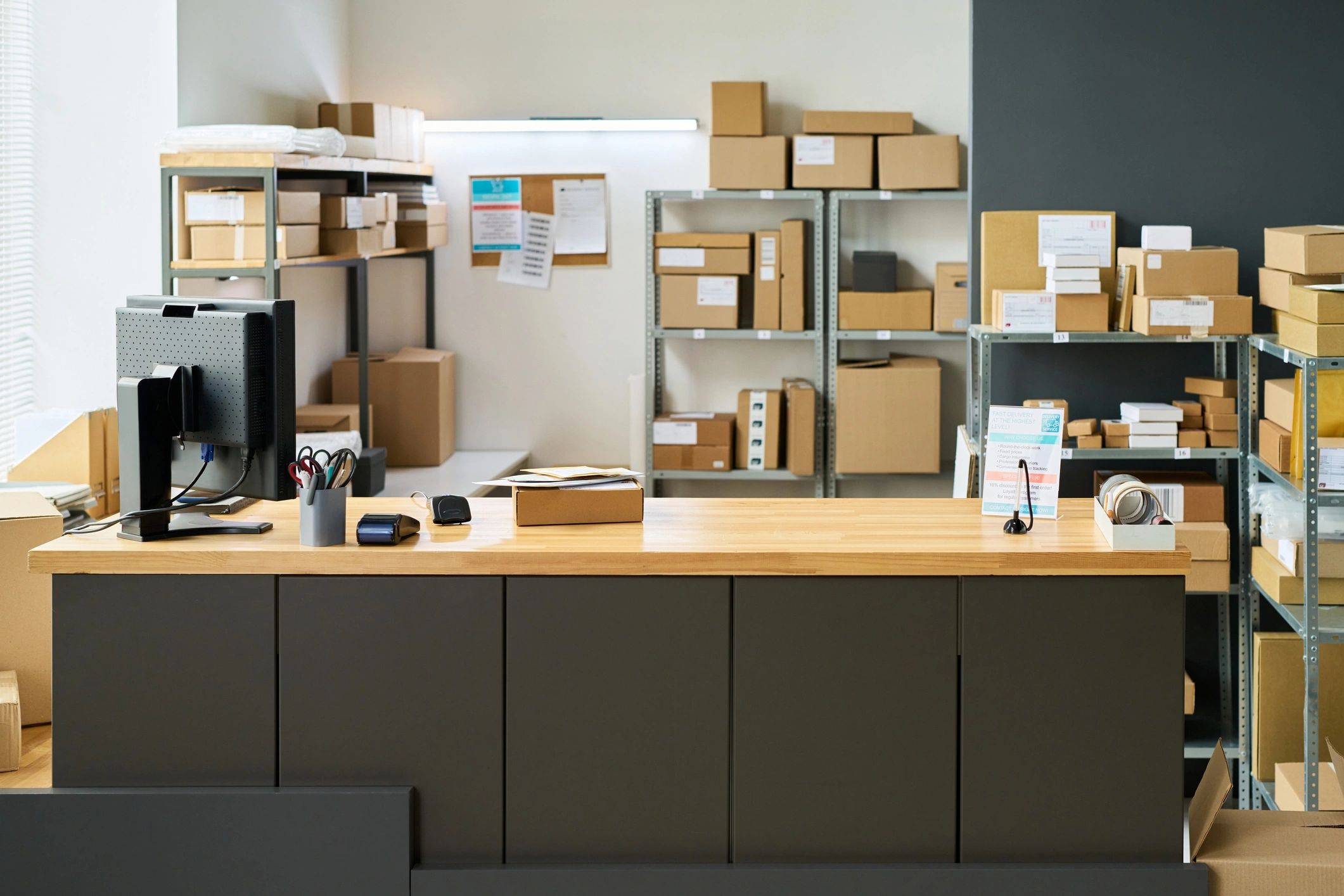 Modern shipping office counter with organized parcel storage