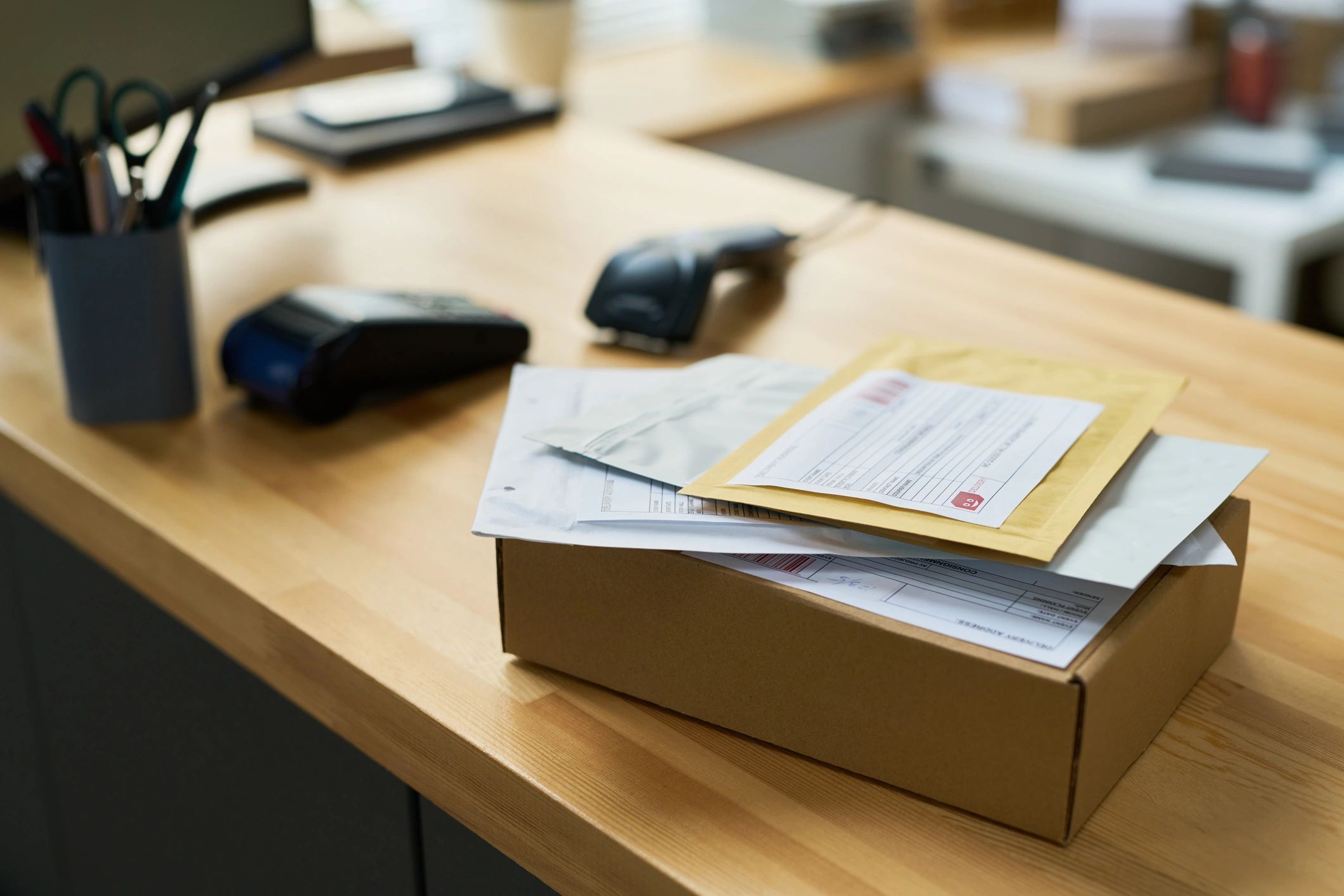 Shipping documents and parcels on an office desk