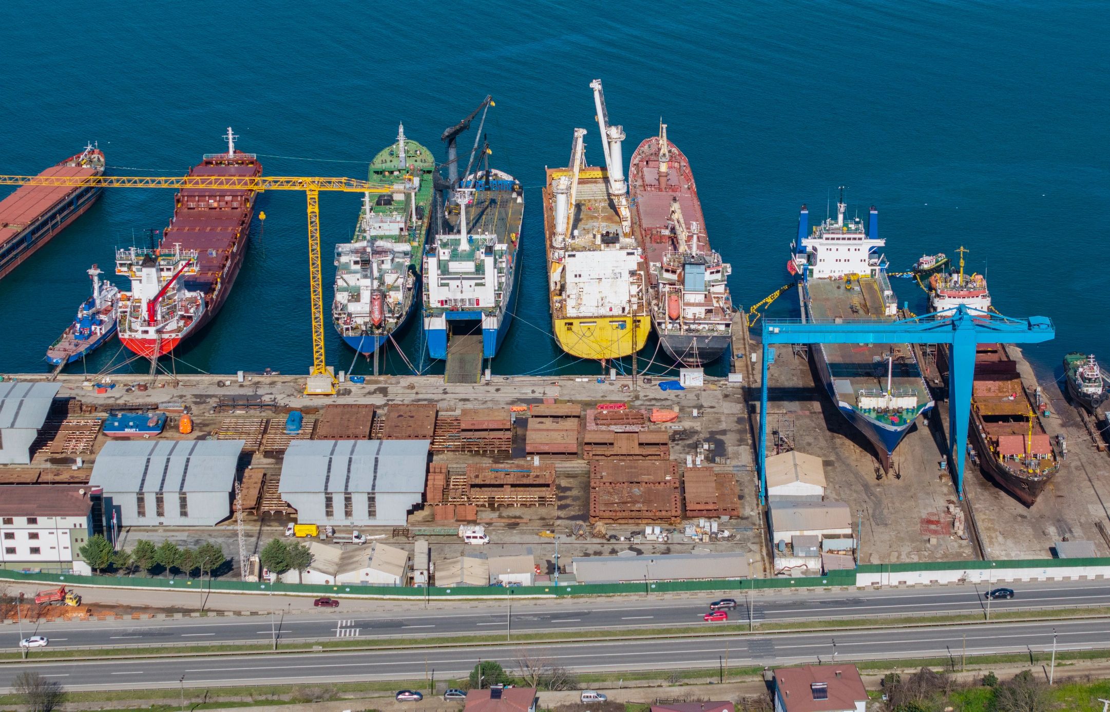Cargo ships and cranes in an industrial port